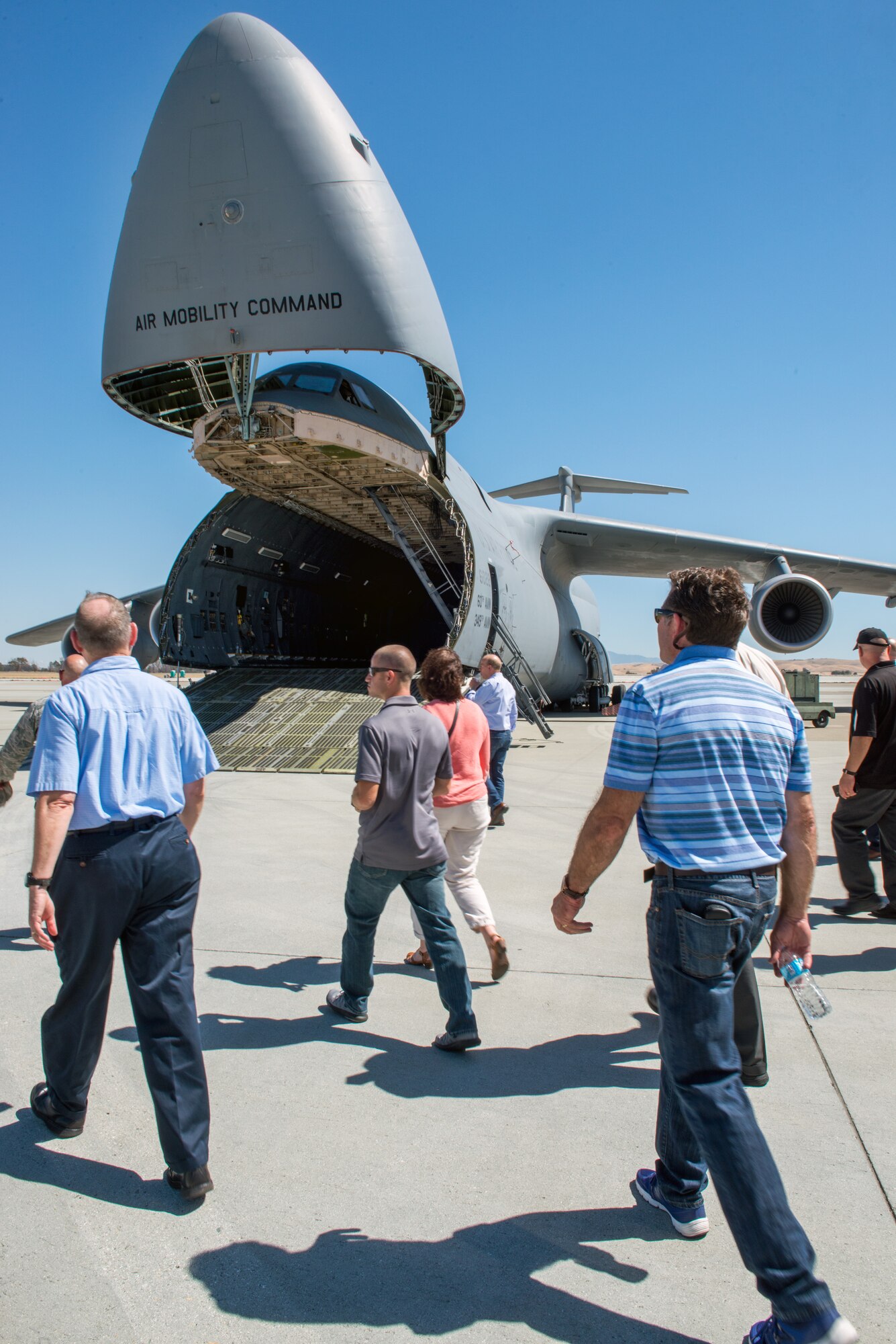 Honorary commanders from Travis Air Force Base, Calif., tour a C-5M Super Galaxy during their tour of the 60th Maintenance Group, July 7, 2017. The purpose of the Honorary Commander Program is to promote relationships between base senior leadership and civilian partners, foster civic appreciation of the Air Force mission and its Airmen, maximize opportunities to share the Air Force story with new stewards, and to communicate the mutual interests, challenges, and concerns that senior leaders and civilian stakeholders have in common. (U.S. Air Force photo by Louis Briscese)