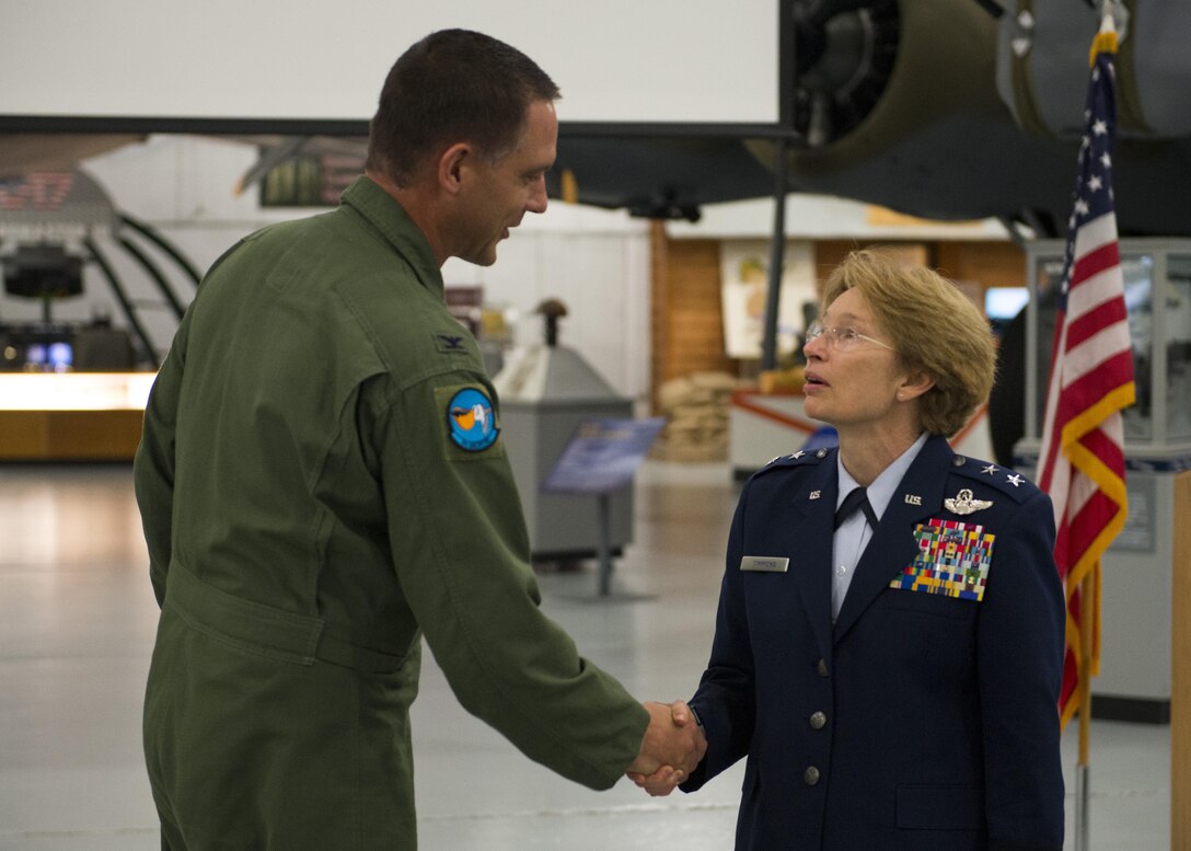 Col. Ethan Griffin, 436th Airlift Wing commander, presents a coin to Maj. Gen. Carol Timmons, adjutant general of Delaware, during a Hangar Talk June 6, 2017, at the Air Mobility Command on Dover Air Force Base, Del. One purpose of the event was to increase understanding between Team Dover’s active duty and Reserve components with Timmons and the Delaware Air National Guard, based out of New Castle Air National Guard Base, Delaware. (U.S. Air Force photo by Senior Airman Zachary Cacicia)
