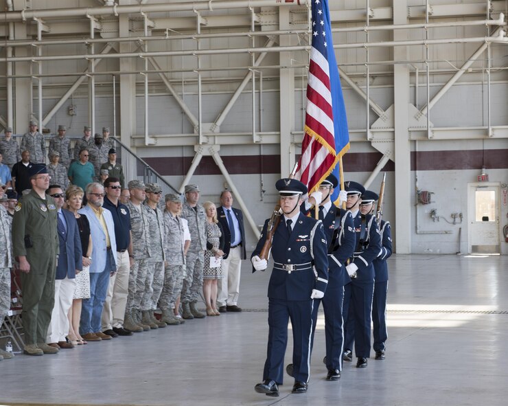 U.S. Airmen from the Travis Air Force Base Honor Guard march with the colors during the 60th Operations Group Change of Command Ceremony at Travis AFB, Calif., Jul 7, 2017. The 60th OG is responsible for daily air operations of the largest air mobility wing in the United States Air Force. With more than 1,000 personnel and $8.5 billion in assets, the group is tasked with operating 18 C-5M Super Galaxys, 13 C-17 Globemasters, and 27 KC-10 Extender aircraft on worldwide mobility and air refueling missions. In addition, the 60 OG manages all mission support activities, to include an operations support squadron providing air traffic control, weather, intelligence, flight management support, aircrew flight equipment, and KC-10 initial qualification and upgrade training. The ceremony rooted in military history dating back to the 18th Century where the command flag is passed to the individual assuming command in the presence of the entire unit. (U.S. Air Force photo by Heide Couch)
