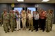 Goodfellow Air Force Base and San Angelo, Texas leaders pose for a photo while doing the 315th Training Squadron hand sign at the Di Tomasso Hall on Goodfellow Air Force Base, Texas, July 7, 2017. The group photo was the last event in a base orientation tour for new community leaders. (U.S. Air Force photo by Staff Sgt. Joshua Edwards/Released)