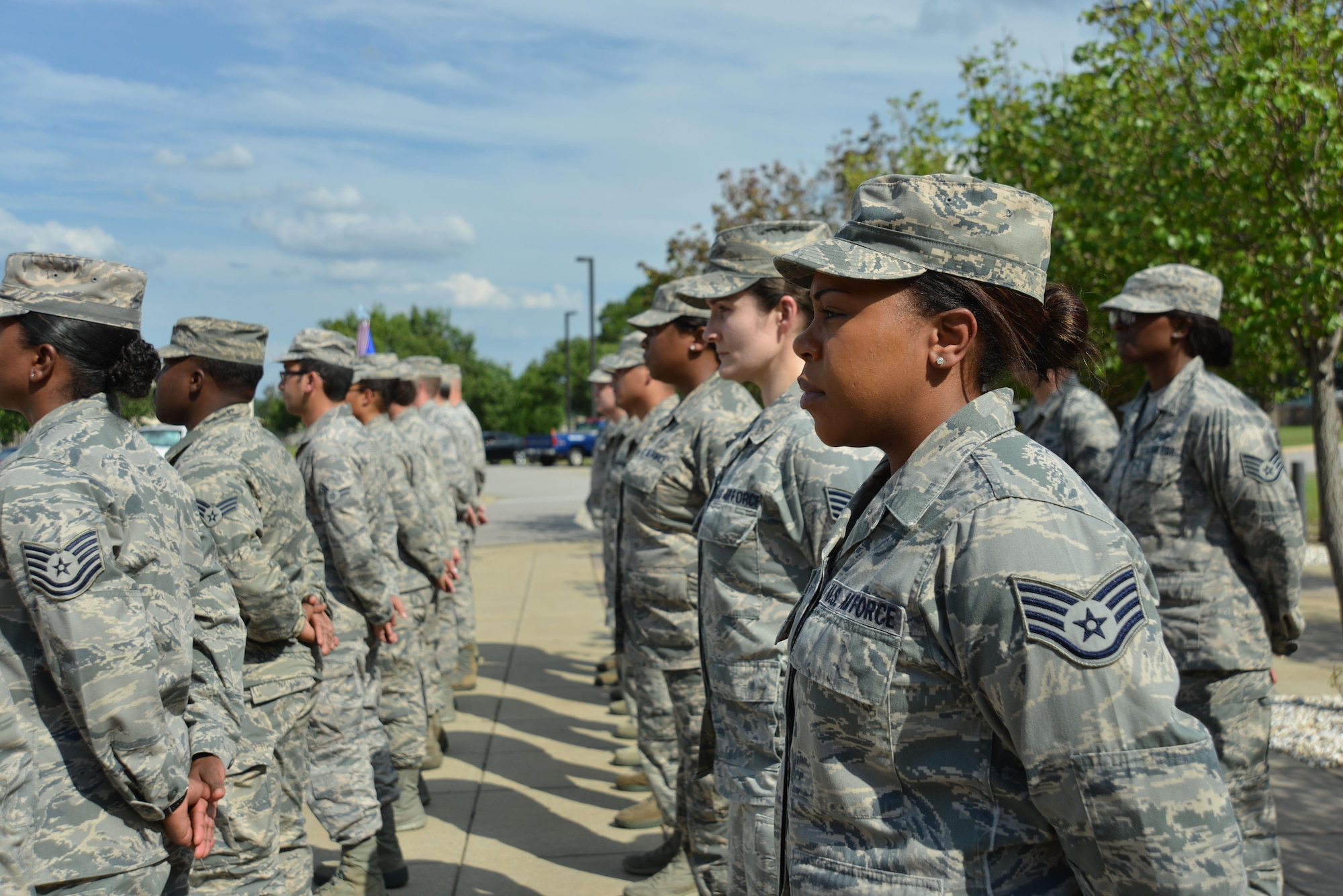 U.S. Airmen assigned to the 20th Fighter Wing (FW) stand in formation prior to a retreat ceremony at Shaw Air Force Base, S.C., June 29, 2017. The Airmen stood at attention while their wingmen in the 20th Comptroller Squadron and Wing Staff Agencies performed the retreat ceremony at the 20th FW Headquarters. (U.S. Air Force photo by Airman 1st Class Destinee Sweeney)