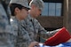 U.S. Air Force Staff Sgt. Justin Prince, 20th Comptroller Squadron finance customer service noncommissioned officer in charge, right, folds the flag during a retreat ceremony as Airman 1st Class Kathryn Reaves, 20th Fighter Wing (FW) Pubic Affairs photojournalist apprentice, holds the flag at Shaw Air Force Base, S.C., June 29, 2017. The flag detail will rotate amongst 20th FW squadrons on a monthly basis, giving Airmen in squadrons an opportunity to pay their respects to the flag. (U.S. Air Force photo by Airman 1st Class Destinee Sweeney)