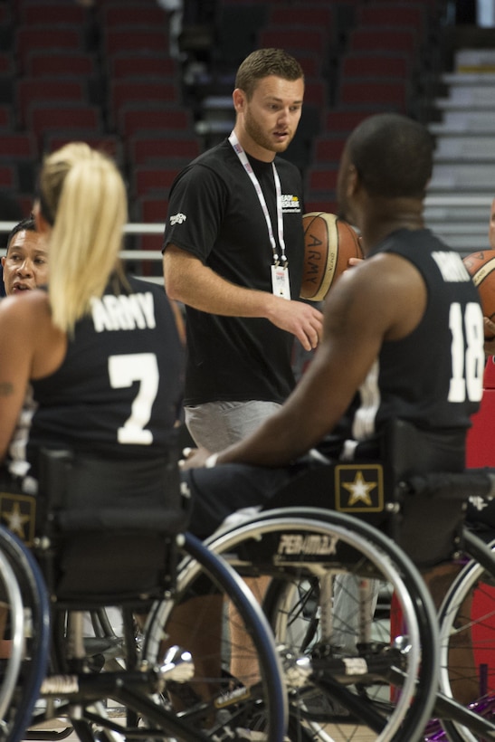 Brett Sandwick, a resilience training performance expert, works with the Army wheelchair basketball team at the 2017 Dept. of Defense Warrior Games at the United Center in Chicago, July 7, 2017. DoD photo by EJ Hersom