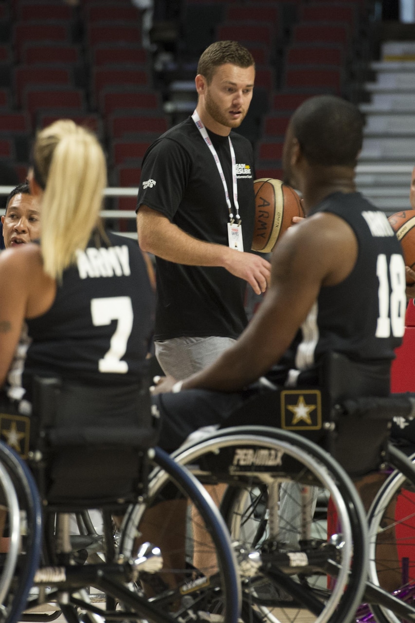 Brett Sandwick, a resilience training performance expert, works with the Army wheelchair basketball team at the 2017 Dept. of Defense Warrior Games at the United Center in Chicago, July 7, 2017. DoD photo by EJ Hersom