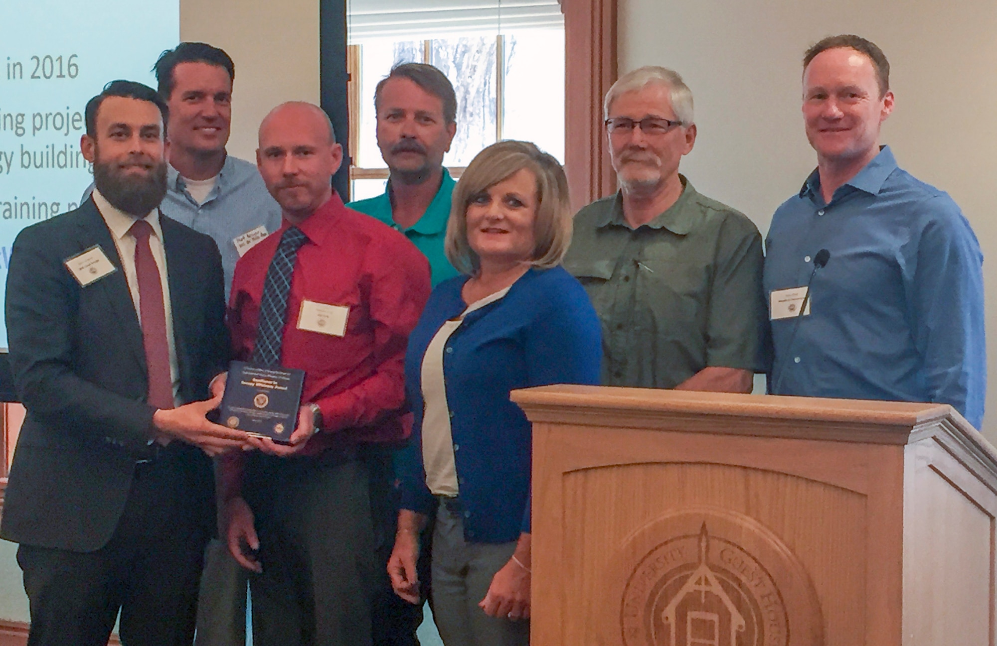 The Hill Energy Management Office accepts an award as part of the Utah Industrial Energy Efficiency Challenge. Front row from the left are Kevin Emerson, Nickolas King, and Karen Bastian. Second row from the left are Matthew Meyer, Mark Persico, Larry Hamberg, and Brian Walsh. (Courtesy photo)