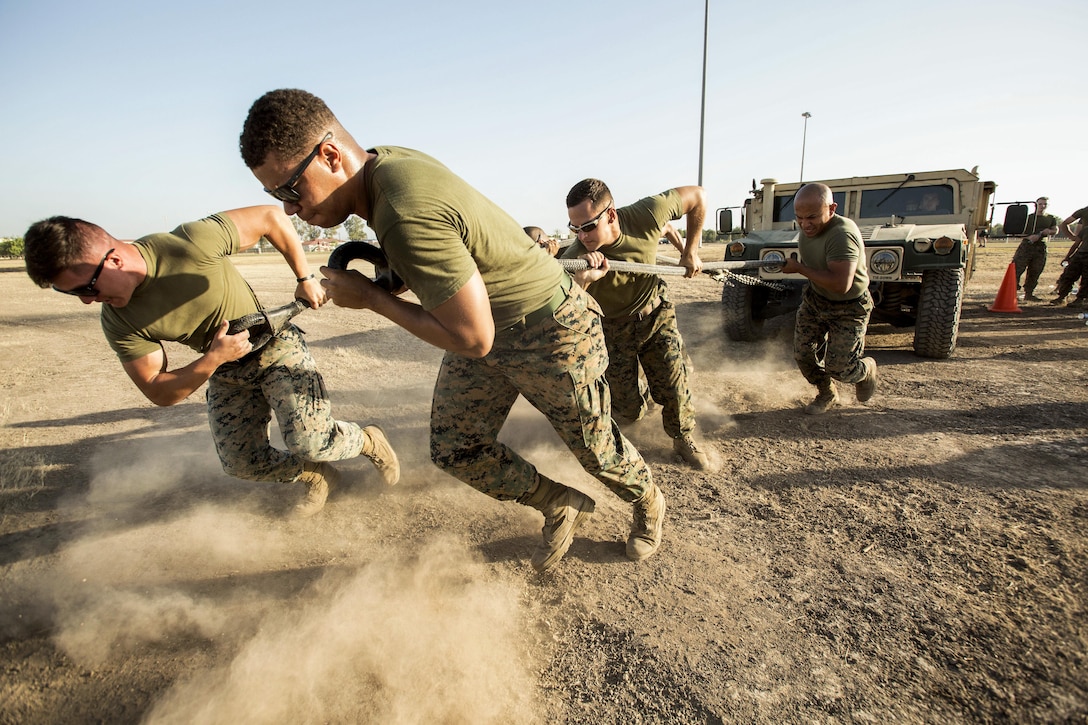 Marines pull a Humvee during a field meet between platoons at Moron Air Base, Spain, July 5, 2017. The Marines are assigned to Special Purpose Marine Air-Ground Task Force Crisis Response Africa combat logistics detachment. Marine Corps photo by Staff Sgt. Kenneth K. Trotter Jr.