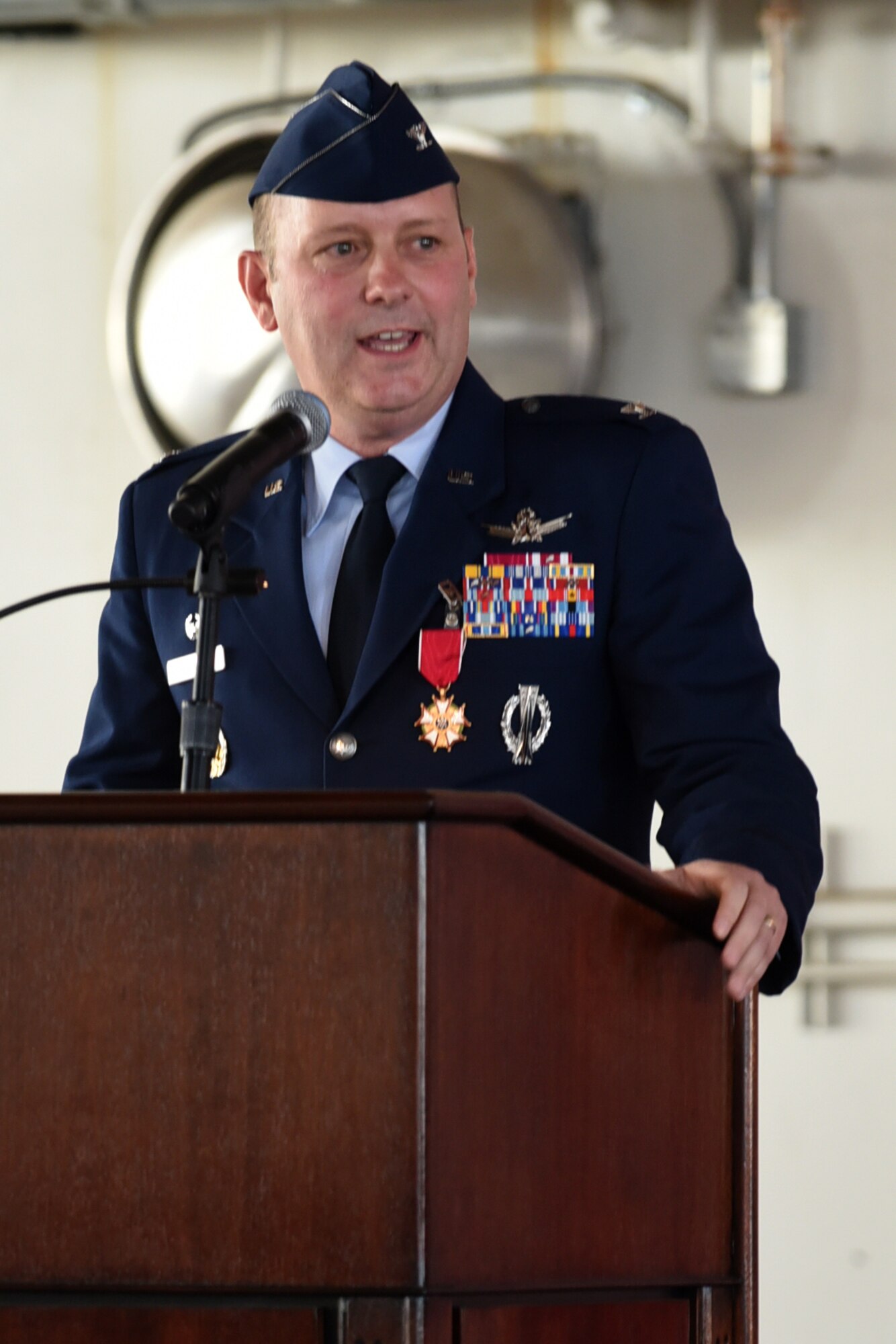 PETERSON AIR FORCE BASE, Colo. – Col. Doug Schiess, 21st Space Wing commander, speaks to Airmen at the 21st SW change of command ceremony in hangar 140, July 11, 2017, at Peterson Air Force Base, Colo. Schiess relinquished command to Col. Todd Moore, former Air Force Element commander at Royal Air Force Menwith Hill. (U.S. Air Force photo by Robb Lingley)