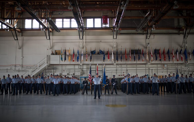 PETERSON AIR FORCE BASE, Colo. – Col. Eric Dorminey, 21st Space Wing vice commander, leads the base formation during the 21st SW change of command ceremony in hangar 140, Peterson Air Force Base, Colo., July 11, 2017. The base formation consisted of Airmen and group commanders from 21st Medical Group, 21st Operations Group, 21st Mission Support Group, 21st Wing Staff Agency and 721st Mission Support Group. (U.S. Air Force photo by Senior Airman Dennis Hoffman)