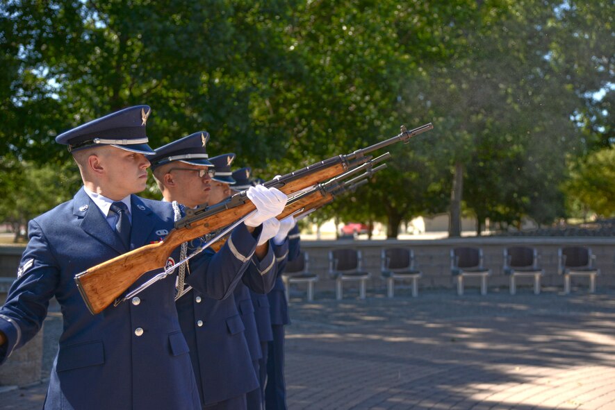 Honor guard members fire the ceremonial M1 rifle during a mock funeral ceremony at Laughlin Air Force Base, Tx., July 10, 2017.  The firing party consisted of Laughlin’s seven newest honor guard members.  (U.S. Air Force/photo Airman 1st Class Daniel Hambor)