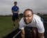 Josh Hale, 42nd Force Support Squadron personal trainer, starts his stop watch as Senior Airman Christopher Snowden, 42nd Command Post command and control operations specialist, trains for his physical training test, June 27, 2017, Maxwell Air Force Base, Ala. After failing an Air Force Physical Training test, Snowden sought out the help of Hale, who helped him improve his run time by one minute and 15 seconds in only three weeks. (U.S. Air Force photo/ Senior Airman Alexa Culbert)