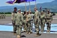 Col. Keith McKinley (left), Joint Task Force-bravo commander, Admiral Kurt Tidd (center) commander of U.S. Southern Command and Col. Brian Hughes (right), former commander of JTF-Bravo stand for the passing of the colors at Soto Cano Air Base, Honduras during the Change of Command ceremony July 10th, 2017.