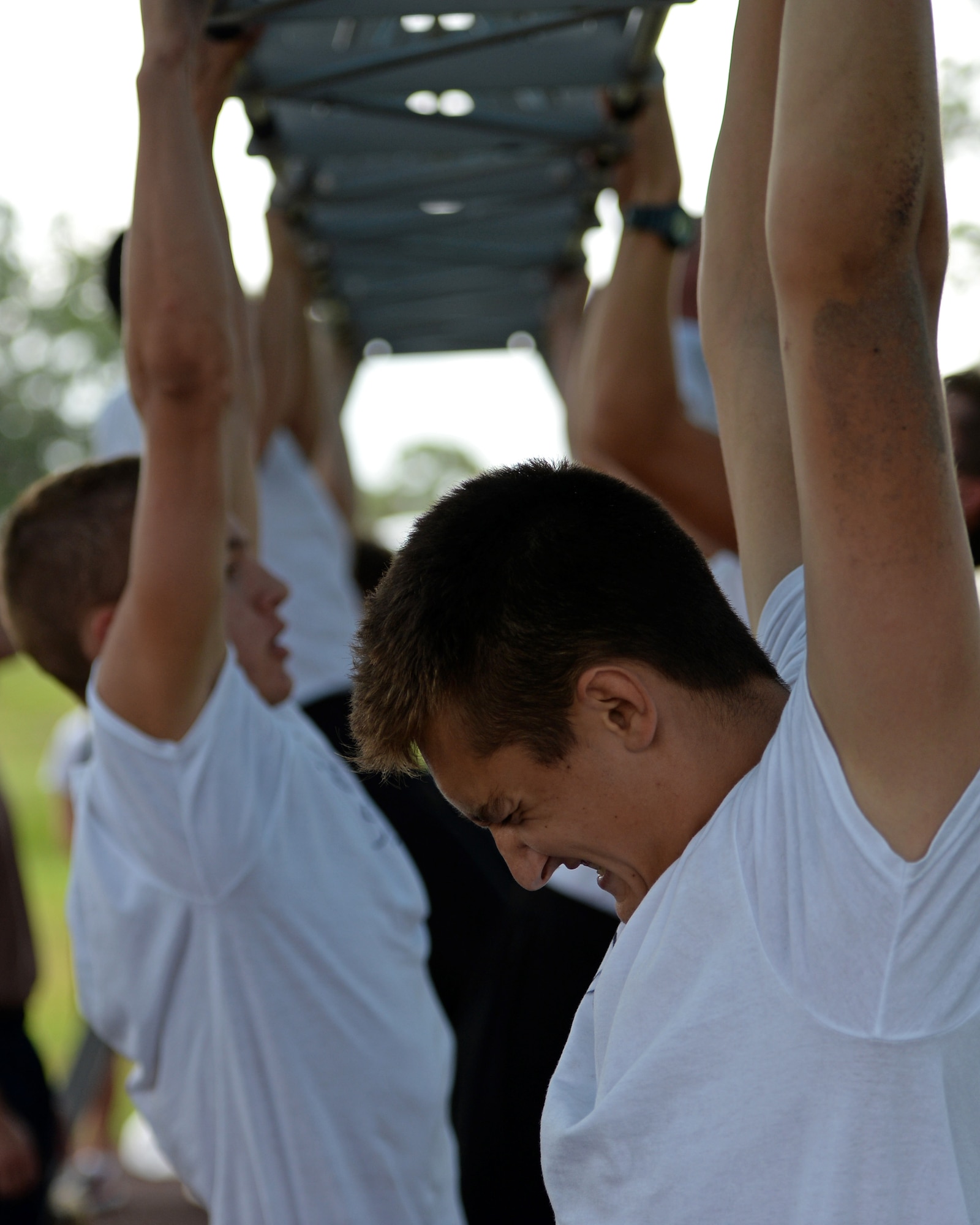 U.S. Naval Sea Cadet Corps cadets plunge into a pool in preparation for a swim evaluation at Tyndall Air Force Base, Fla., June 25, 2017. The USNSCC is a Department of the Navy program for young adults, ages 16 to 18, aimed at fostering an improved image and understanding of what the maritime services have to offer. (U.S. Air Force photo by Airman 1st Class Isaiah J. Soliz/Released)