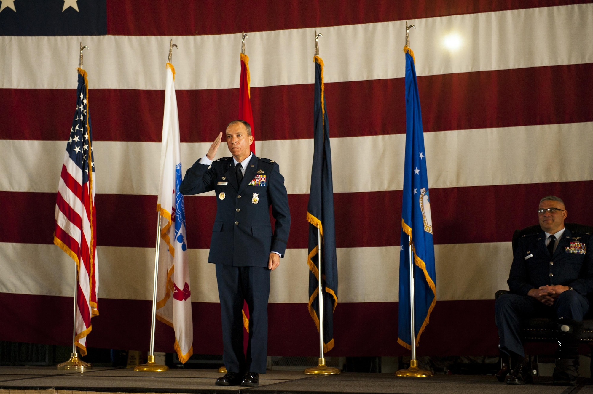 U.S. Air Force Lt. Col. Scott D. Cline, 312th Training Squadron Commander, salutes the 312th TRS for the first time during the 312th TRS change of command at the Louis F. Garland Department of Defense Fire Academy High Bay Fire Academy high bay on Goodfellow Air Force Base, Texas, July 10, 2017. The change of command ceremony is a time honored military tradition that signifies the orderly transfer of authority. (U.S. Air Force photo by Senior Airman Scott Jackson/Released)