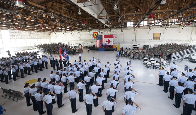 Airmen from the 21st Space Wing render their last salute to Col. Doug Schiess, 21st SW outgoing commander, during the 21st SW change of command ceremony in hangar 140, Peterson Air Force Base, Colo., July 11, 2017. The change command ceremony has its roots in U.S. military traditions dating back to the early 1800s. (U.S. Air Force photo Steve Kotecki)