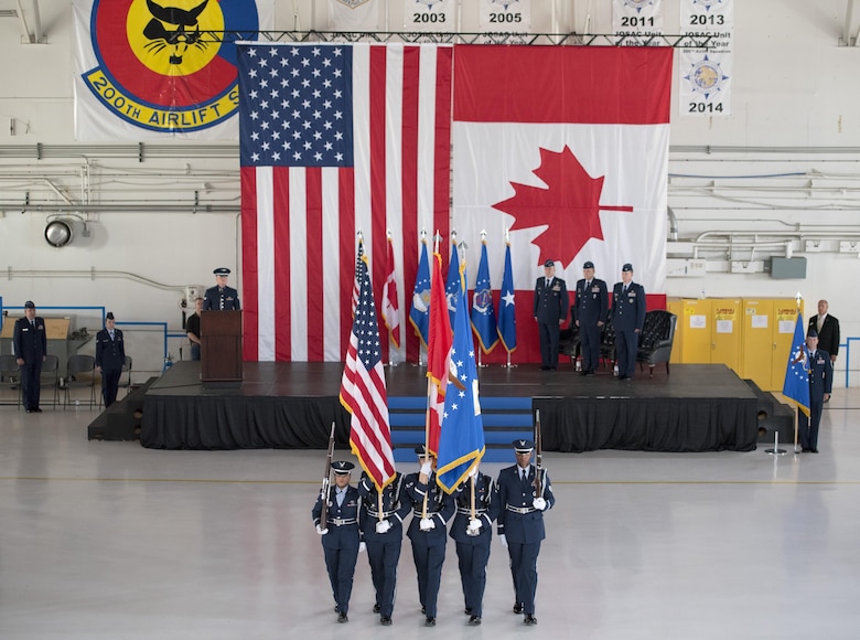 The High Frontier Honor Guard presents the national ensign along with the Air Force and 21st Space Wing colors, during the 21st SW change of command ceremony in hangar 140, Peterson Air Force Base, Colo., July 11, 2017. Lt. Gen. David J. Buck, Commander, 14th Air Force (Air Forces Strategic), Air Force Space Command; and Commander, Joint Functional Component Command for Space, U.S. Strategic Command, Vandenberg Air Force Base, Calif., presided as Col. Todd Moore assumed command of the 21st SW from Col. Doug Schiess. (U.S. Air Force photo Steve Kotecki)