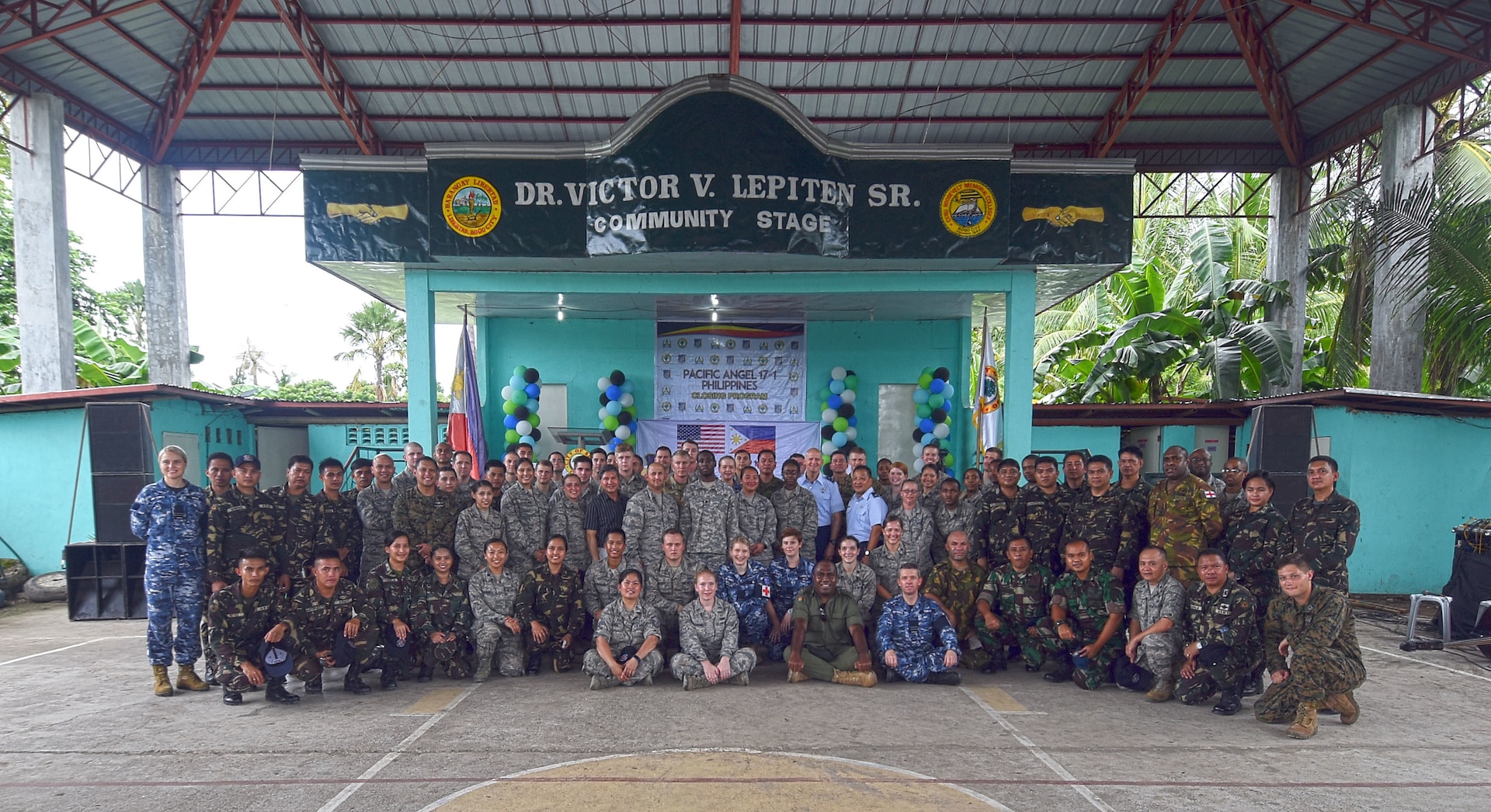 Members of Pacific Angel (PACANGEL) 2017 pose for a group photo during the closing the ceremony in Bogo City, Northern Cebu Province, Philippines, July 3, 2017. PACANGEL is a multilateral humanitarian assistance civil military engagement, which improves military-to-military partnerships in the Pacific while also providing medical health outreach, civic engineering projects and subject matter exchanges among partner forces. 