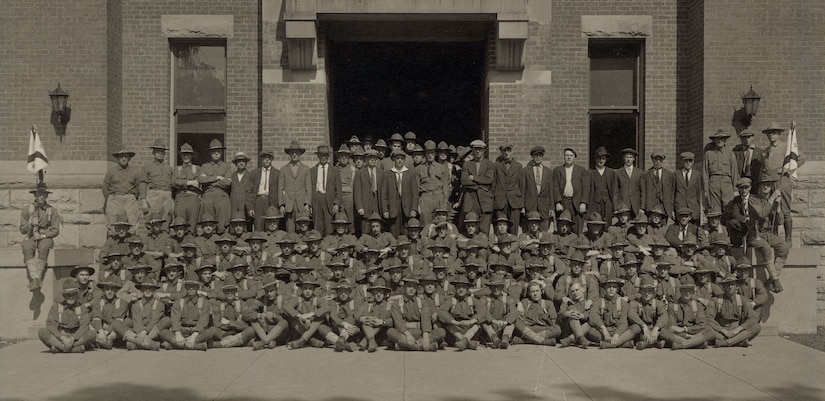 New York National Guard Soldiers assigned to Company G, 1st New York State Infantry gather outside their armory in Oneonta, N.Y. sometime in July , 1917, following their mobilization for duty in World War I. The men not in uniform were new recruits. 