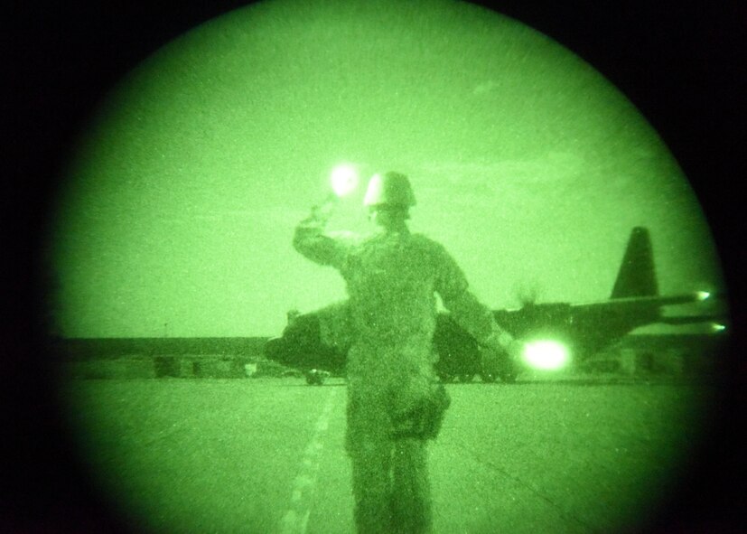 U.S. Air Force Senior Airman Jarrod Darnell, an expeditionary maintenance liaison deployed in support of Combined Joint Task Force – Operation Inherent Resolve and assigned to the 370th Air Expeditionary Advisory Group, marshals in a C-130 Hercules at Qayyarah West Airfield, Iraq, July 1, 2017. The U.S. Air Force supports the CJTF-OIR advise and assist mission by working closely with the Iraqi air force and army aviation command to manage the airfield operations at Qayyarah West. CJTF-OIR is the global Coalition to defeat ISIS in Iraq and Syria. (U.S. Air Force photo by Tech. Sgt. Jonathan Hehnly)