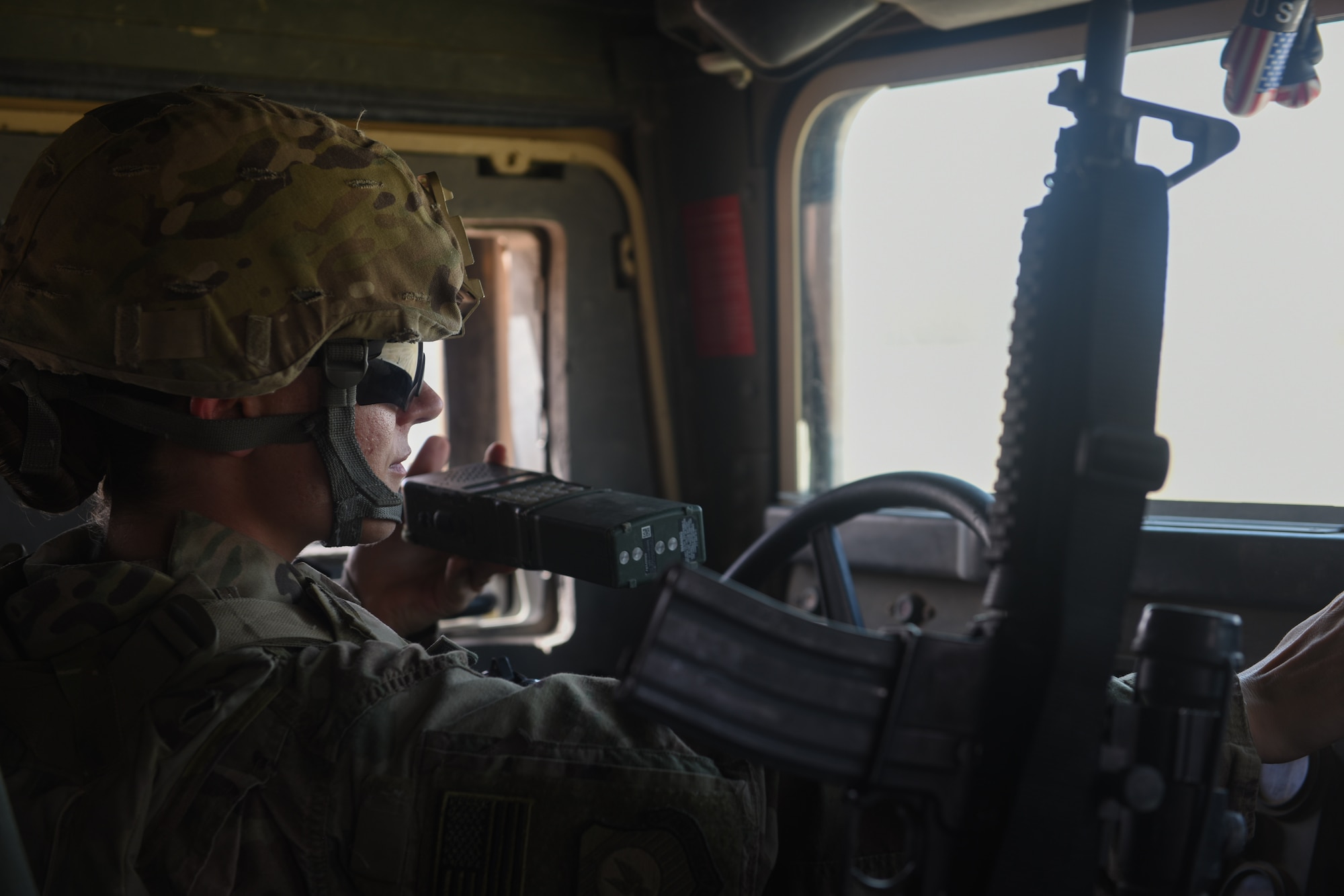 U.S. Air Force Master Sgt. Shannon Hawkins, an airfield manager deployed in support of Combined Joint Task Force – Operation Inherent Resolve and assigned to the 370th Air Expeditionary Advisory Group, Detachment 1, communicates with air traffic controllers over the radio in a Humvee at Qayyarah West Airfield, Iraq, July 2, 2017. To ensure seamless control of both Iraqi and Coalition air traffic, the U.S. Air Force’s 370th supports the CJTF-OIR advise and assist mission by having a small team of air advisors at Qayyarah West airfield working alongside the Iraqis advising and assisting in day-to-day airfield operations. CJTF-OIR is the global Coalition to defeat ISIS in Iraq and Syria. (U.S. Air Force photo by Tech. Sgt. Jonathan Hehnly)