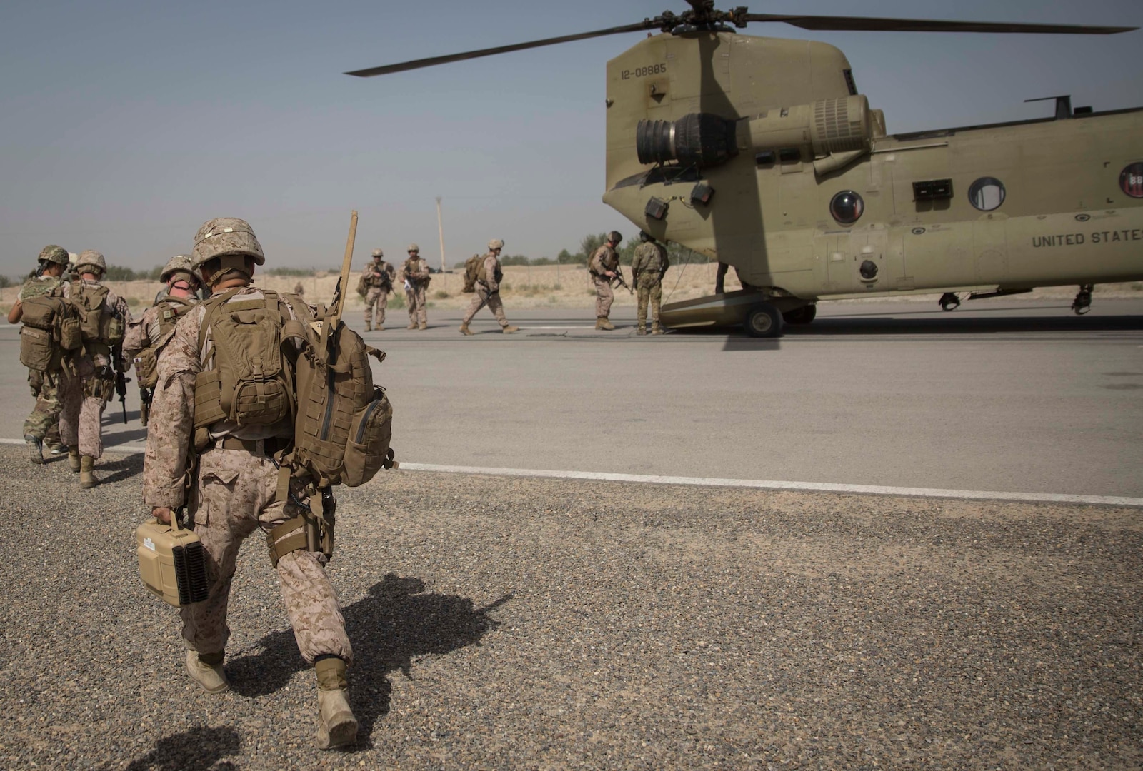 U.S. Marine advisors with Task Force Southwest load up on a CH-47 Chinook at Bost Airfield, Afghanistan, July 9, 2017. Task Force Southwest, comprised of approximately 300 Marines and Sailors from II Marine Expeditionary Force, are training, advising and assisting the Afghan National Army 215th Corps and the 505th Zone National Police. (U.S. Marine Corps photo by Sgt. Justin T. Updegraff)