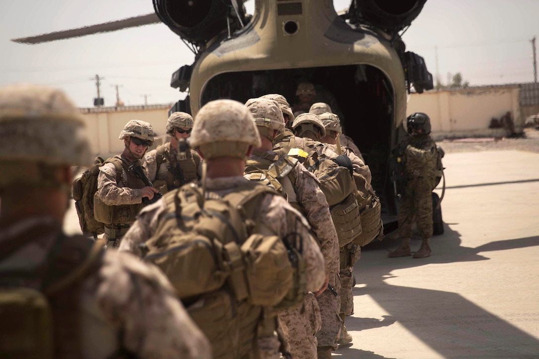 U.S. Marine advisors board a CH-47 Chinook helicopter after a train, advise and assist mission at the Helmand Provincial Police Headquarters in Lashkar Gah, Afghanistan, July 9, 2017. Marine Corps photo by Sgt. Justin T. Updegraff