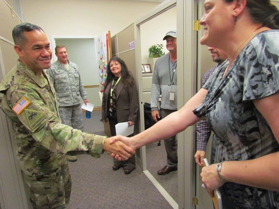 DLA Senior Enlisted Leader Command Sgt. Maj. Charles Tobin greets customer support managers in the Planning and Support Division of DLA Aviation at Ogden during a trip to Hill Air Force Base, Utah. 