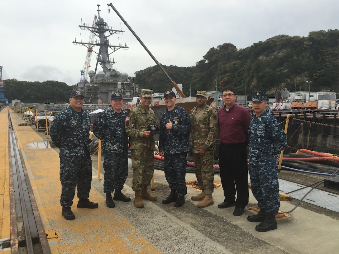 Defense Logistics Agency Senior Enlisted Leader Command Sgt. Maj. Charles Tobin, (third from left), visits with senior military and civilian leaders of the USS Blue Ridge (LCC 19) and USS John S. McCain (DDG 56) during his Nov. 9 visit to Yokosuka, Japan. Tobin visited U.S. Army and U.S. Navy customers to discuss logistics support and encourage them to provide DLA with feedback that will allow DLA to serve them better.