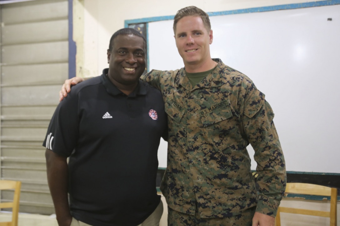Marine Corps Sgt. Mike Meehan poses with Anthony Creece, his former soccer coach, at Mucurapo West Secondary School in Port-of-Spain, Trinidad and Tobago, June 16, 2017. Meehan, a civil affairs specialist with 4th Civil Affairs Group, visited Creece, a teacher in and native of Trinidad and Tobago, while participating in Phase II of Exercise Tradewinds 2017. Marine Corps photo by Sgt. Olivia McDonald