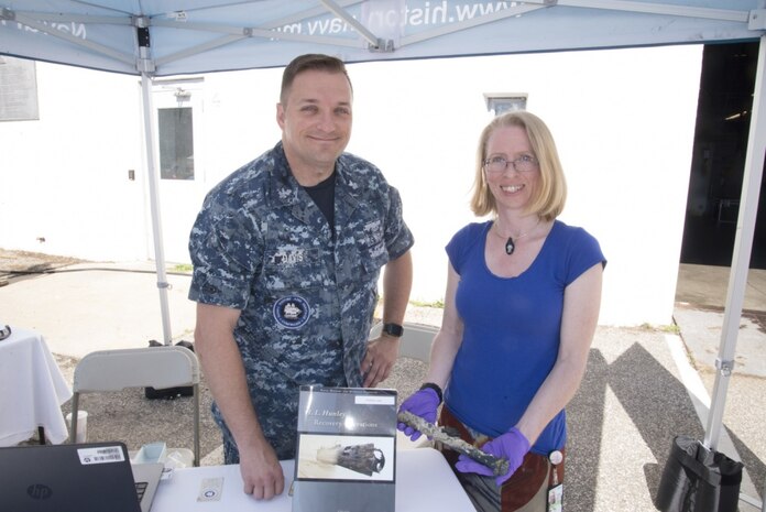 Mass Communications Specialist 1st Class Cliff Davis and Heather Brown from the Naval History and Heritage Command (NHHC) pose with an artifact found from the remains of USS Housatonic, which was sunk during combat by the submarine H.L Hunley on Feb. 17, 1864. Davis and Brown were in attendance at the 2017 International Human-Powered Submarine Races (ISR) held in Naval Surface Warfare Center, Carderock Divisions David Taylor Model Basin in West Bethesda, Maryland, June 25-30. (U.S. Navy photo by Daniel Daglis/Released)