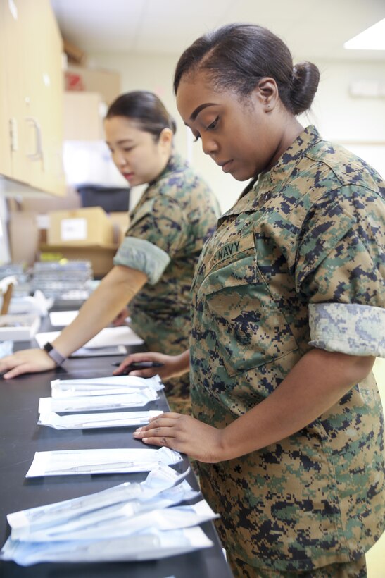 Petty Officer 3rd Class Carlotta Howard (right) and Petty Officer 2nd Class Yani Chu (left), dental corpsmen with 4th Dental Battalion, 4th Marine Logistics Group, Marine Forces Reserve, sterilize dental tools at East St. John High School as they prepare to provide services during Innovative Readiness Training Louisiana Care 2017 in Reserve, La., July 11, 2017. The Louisiana Care Innovative Readiness Training is a joint-service medical mission that provides the military with “hands-on” readiness training opportunities, while at the same time providing direct and lasting benefits to the residents of Louisiana. (Photo by U.S. Marine Pvt. Samantha Schwoch/Released.)