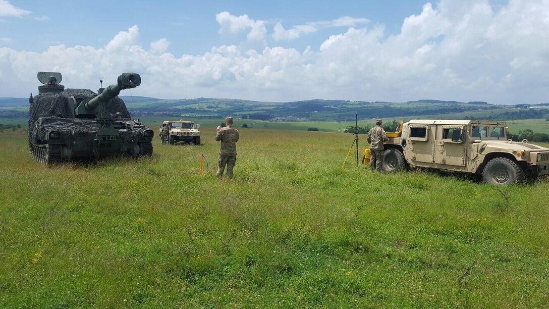 An engineer survey and design team with the 926th Engineer Brigade, an Army Reserve unit from Montgomery, AL, participating in support of Resolute Castle 17, hosts training for artillery crews of 3rd Armored Brigade Combat Team, 4th Infantry Division, on how to establish a known station or control point using GPS at the Cincu Joint National Training Center, Romania, July 6, 2017. Multinational exercises converged as the engineers are working in support of Resolute Castle 2017, a U.S.-led troop construction exercise for U.S. military engineers, and the Soldiers of 3rd Battalion, 29th Field Artillery Regiment, 3/4 ABCT, are also at Cincu for Getica Saber 17, a multinational fire coordination exercise and combined arms live-fire exercise that takes place from July 8-15. (U.S. Army photo by Staff Sgt. Ange Desinor, 3rd Armored Brigade Combat Team, 4th Infantry Division)