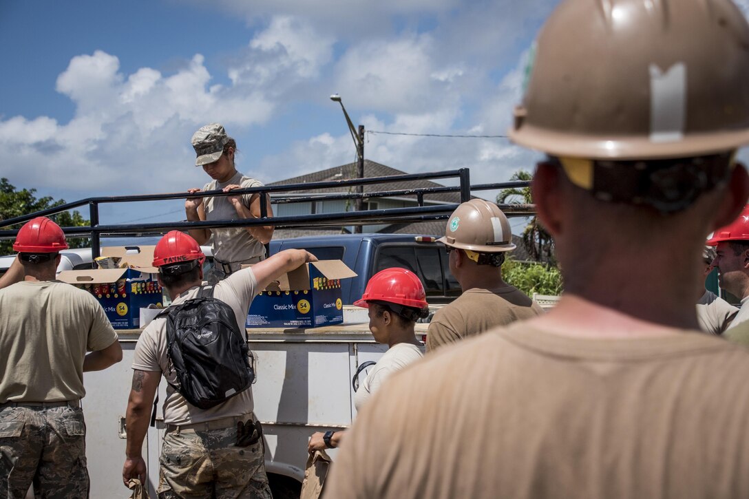 Ohio Air National Guard members, assigned to the 200th Rapid Engineer Deployable Heavy Operational Repair Squadron Engineers, work with Marines and Navy Seabees during Innovative Readiness Training Kapaa, Hawaii, July 4, 2017. Air National Guard photo by 1st Lt. Paul Stennett