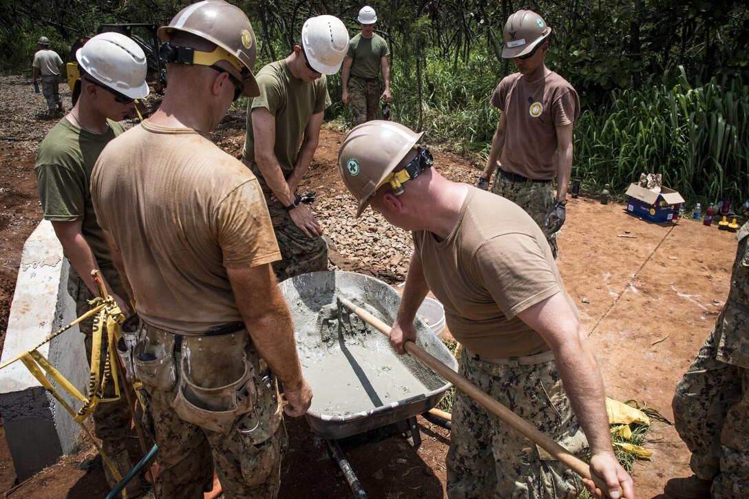 Ohio Air National Guard members work with Marines and Navy Seabees during Innovative Readiness Training in Kapaa, Hawaii, July 4, 2017. Air National Guard photo by 1st Lt. Paul Stennett