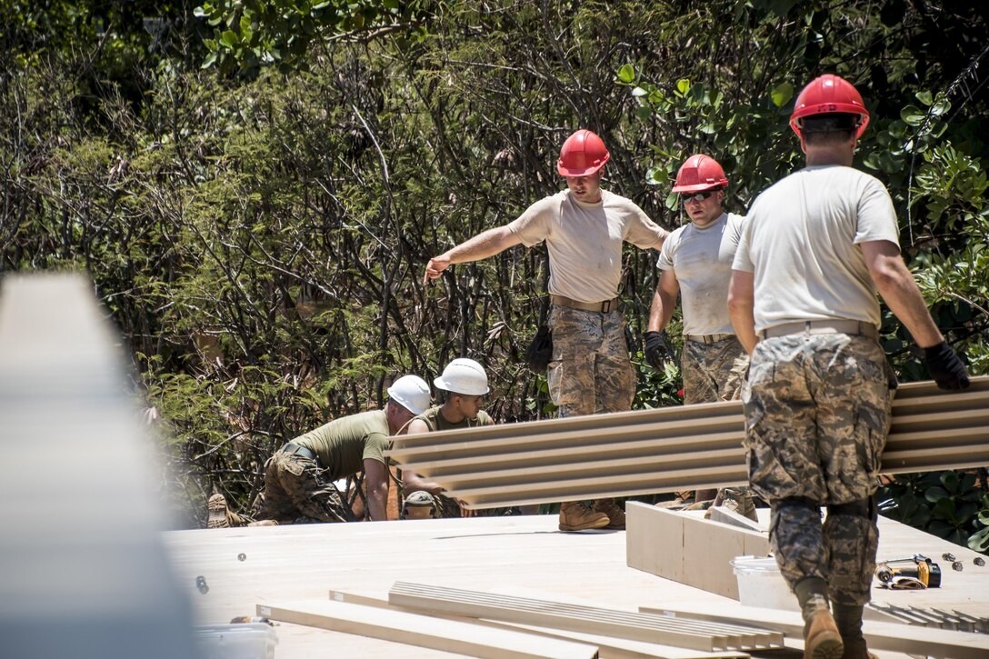 Marines, Navy Seabees and Ohio Air National Guard members work together to conduct an Innovative Readiness Training in Kapaa, Hawaii, July 4, 2017. Air National Guard photo by 1st Lt. Paul Stennett