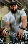 Corey Williams, Fort Eustis Auto Craft Center and Inspection Station mechanic, conducts maintenance on a motorcycle at Joint Base Langley-Eustis, Va., June 28, 2017. Williams spent eight years in the U.S. Army as a mechanic and deployed twice to Iraq before returning to the civilian sector as a mechanic at the auto center. (U.S. Air Force photo/Staff Sgt. Teresa J. Cleveland)