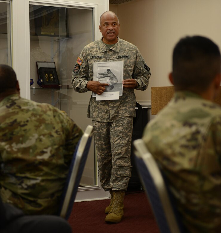 U.S. Army Reserve Chief Warrant Officer Phillip Brashear, 11th Aviation Command CH-47 Chinook helicopter pilot, shares stories and photos of his father, Carl Brashear, during the Fort Eustis Diamond Council’s leadership luncheon at Joint Base Langley-Eustis, Va., June 28, 2017. Carl Brashear, who passed away in 2006, was the first African American graduate from the U.S. Diving and Salvage School in Bayonne, New Jersey and the first African American U.S. Navy diver. (U.S. Air Force photo/Staff Sgt. Teresa J. Cleveland)