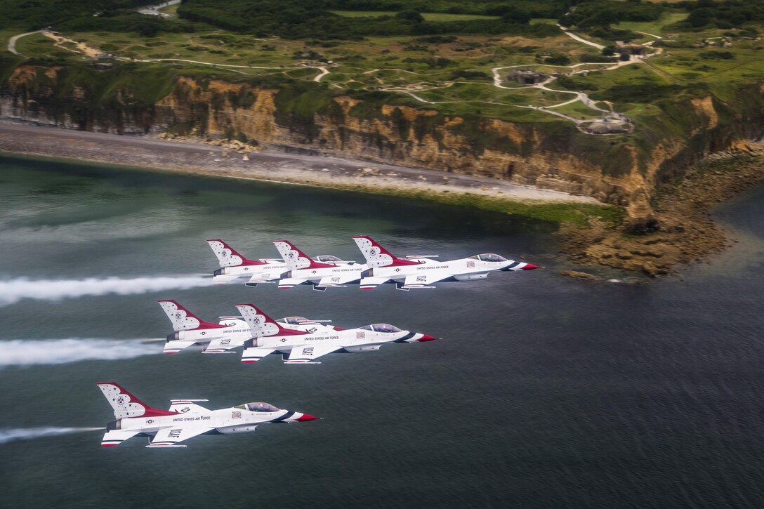 The Thunderbirds, the Air Force’s air demonstration squadron, fly off the coast of Pointe du Hoc in Normandy, France, July 11, 2017. The Thunderbirds flew by several historic sites during a practice for Bastille Day festivities.  Air Force Photo by Tech. Sgt. Christopher Boitz