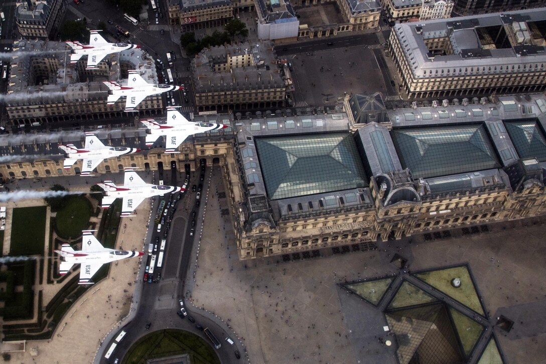 The Air Force Thunderbirds fly over the Louvre Museum during a practice procession of Bastille Day festivities in Paris, July 11, 2017. Air Force Photo by Tech. Sgt. Christopher Boitz