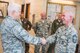 U.S. Air Force Lt. Gen. Scott Rice, director of the Air National Guard, coins Chief Master Sgt. Mark Richie, with the 139th Security Forces Squadron, Missouri Air National Guard, during a tour of Rosecrans Air National Guard Base, St. Joseph, Mo., July 8, 2017. Lt. Gen. Rice and Chief Master Sgt. Ronald Anderson, command chief master sergeant of the Air National Guard, were in the process of visiting units across Missouri. While in St. Joseph, they toured Rosecrans Air National Guard Base, met with commanders and spent time talking with Airmen around the base. (Air National Guard photo by Staff Sgt. Patrick Evenson)