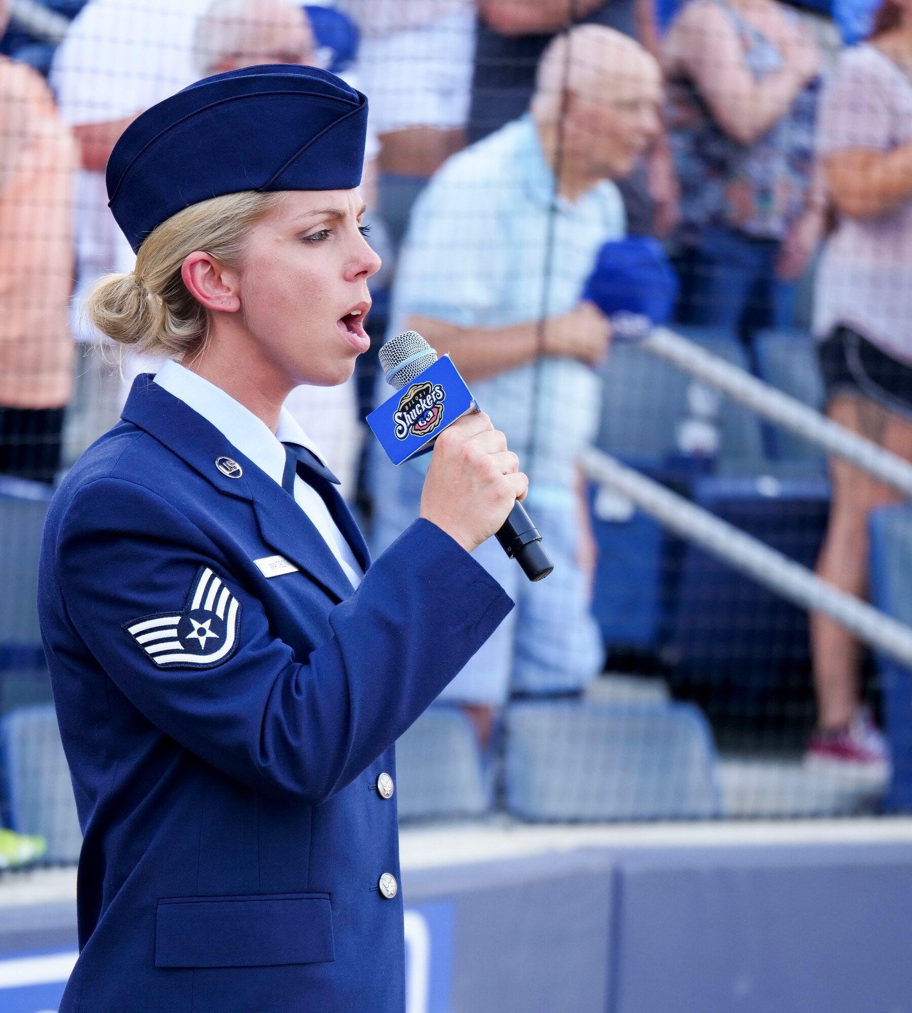Staff Sgt. Jordan Watson, 41st Aerial Port Squadron transportation craftsman, sings the national anthem during the Biloxi Shuckers Minor League Baseball team’s military appreciation night July 8, 2017, in Biloxi, Miss. The Shuckers recognized and honored service members and their families for the dedication, commitment and sacrifices they make for the nation. 

(U.S. Air Force photo by Capt. David J. Murphy)