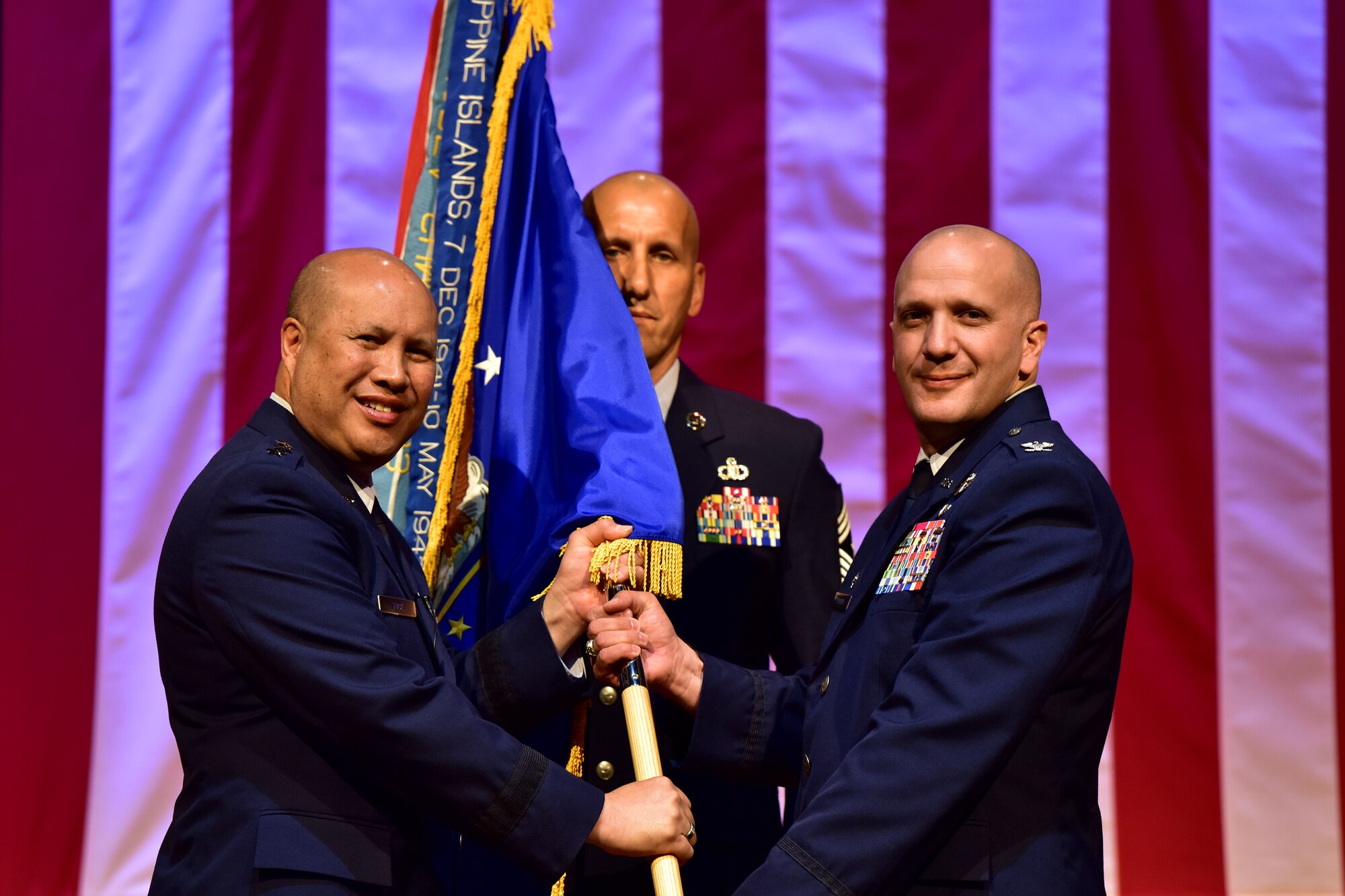 Col. Gerald Donohue accepts command of the 19th Airlift Wing from Lt. Gen. Giovanni Tuck, 18th Air Force commander, July 11, 2017 at Little Rock Air Force Base, Ark. The 19th AW is home to more than 6,000 Combat Airlift personnel and the world’s largest C-130 base. (U.S. Air Force photo by Staff Sgt. Jeremy McGuffin)