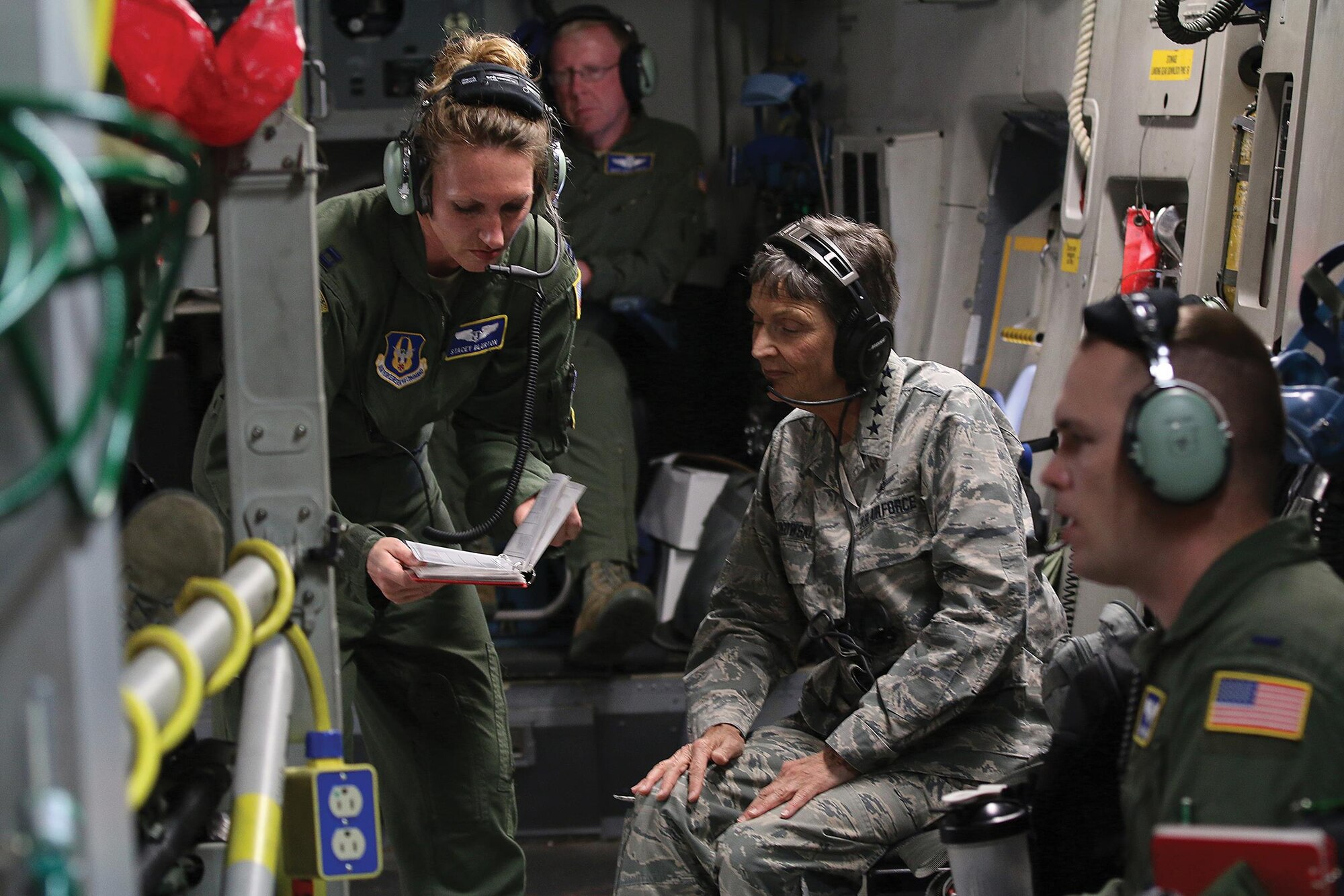 Capt. Stacey Blurton, 445th Aeromedical Evacuation Squadron flight nurse, explains to Gen. Ellen Pawlikowski, Commander, Air Force Materiel Command, the various checklists AES Airmen must follow for each flying mission during a training flight onboard a 445th Airlift Wing C-17 Globemaster III June 20, 2017. The general was shown the various equipment used by AES and saw the Airmen perform various medical emergency scenarios during the flight. (U.S. Air Force photo/Tech. Sgt. Patrick O’Reilly)