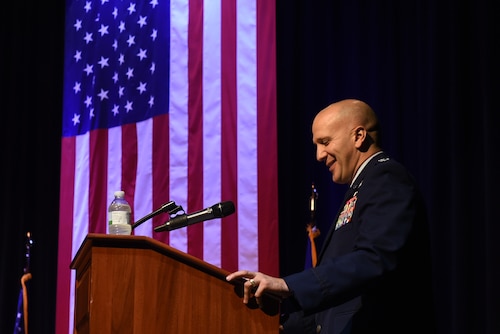 Col. Gerald Donohue, 19th Airlift Wing commander, gives his first remarks after accepting command of the wing, July 11, 2017, at the Herk Hall on Little Rock Air Force Base, Ark. Donohue assumed command of the 19th AW from Col. Charles Brown in a ceremony presided by Lt. Gen. Giovanni Tuck, 18th Air Force commander. (U.S. Air Force photo by Airman 1st Class Kevin Sommer Giron)