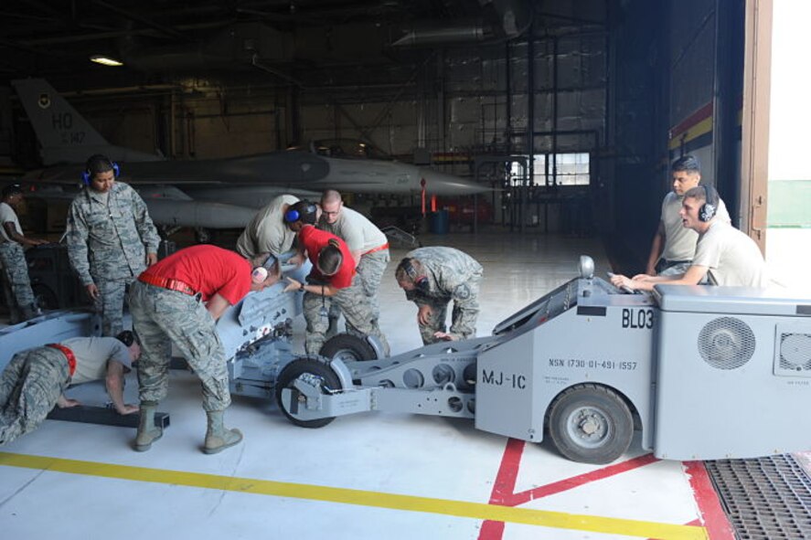 Weapons load crews from the 388th Fighter Wing’s 34th Aircraft Maintenance Unit initiated certification training at Hill Air Force Base, Utah, July 7, 2017, to load external pylons on F-35As. The removable pylons are used to secure external munitions under the aircraft’s wings enhancing its combat capability. The jet is designed to carry up to 18,000 pounds of munitions on 11 internal and external weapons stations depending on mission requirements. (U.S. Air Force photo/Donovan K. Potter)