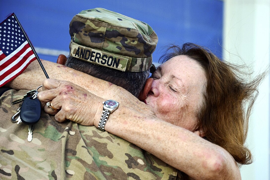 An Army National Guardsman embraces a loved one upon returning to Virginia, July 10, 2017, from a deployment to the Middle East supporting Task Force Spartan Shield. The soldier is assigned to the Fort Belvoir-based 29th Infantry Division. Army National Guard photo by Sgt. 1st Terra C. Gatti