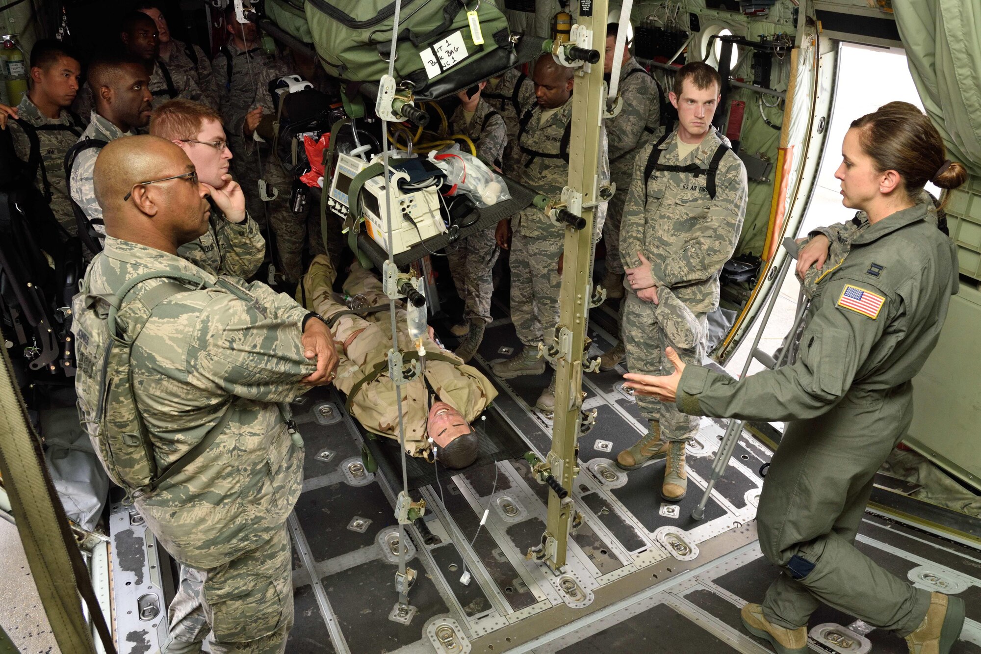 Capt. Kristen Parham (right), 36th Aeromedical Evacuation Squadron nurse, addresses a group of Air Force chaplain candidates during their tour of the 403rd Wing at Keesler Air Force Base, Mississippi, July 8, 2017. The candidates visited with several Air Force wings to get a better feel for how they support the Air Force mission and to meet with the Airmen that could interact with during their careers as chaplains. (U.S. Air Force photo/Tech. Sgt. Ryan Labadens)