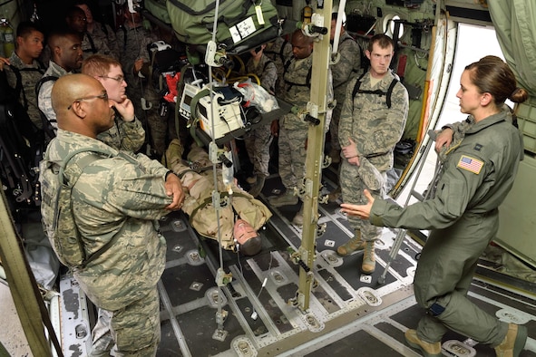 Capt. Kristen Parham (right), 36th Aeromedical Evacuation Squadron nurse, addresses a group of Air Force chaplain candidates during their tour of the 403rd Wing at Keesler Air Force Base, Mississippi, July 8, 2017. The candidates visited with several Air Force wings to get a better feel for how they support the Air Force mission and to meet with the Airmen that could interact with during their careers as chaplains. (U.S. Air Force photo/Tech. Sgt. Ryan Labadens)