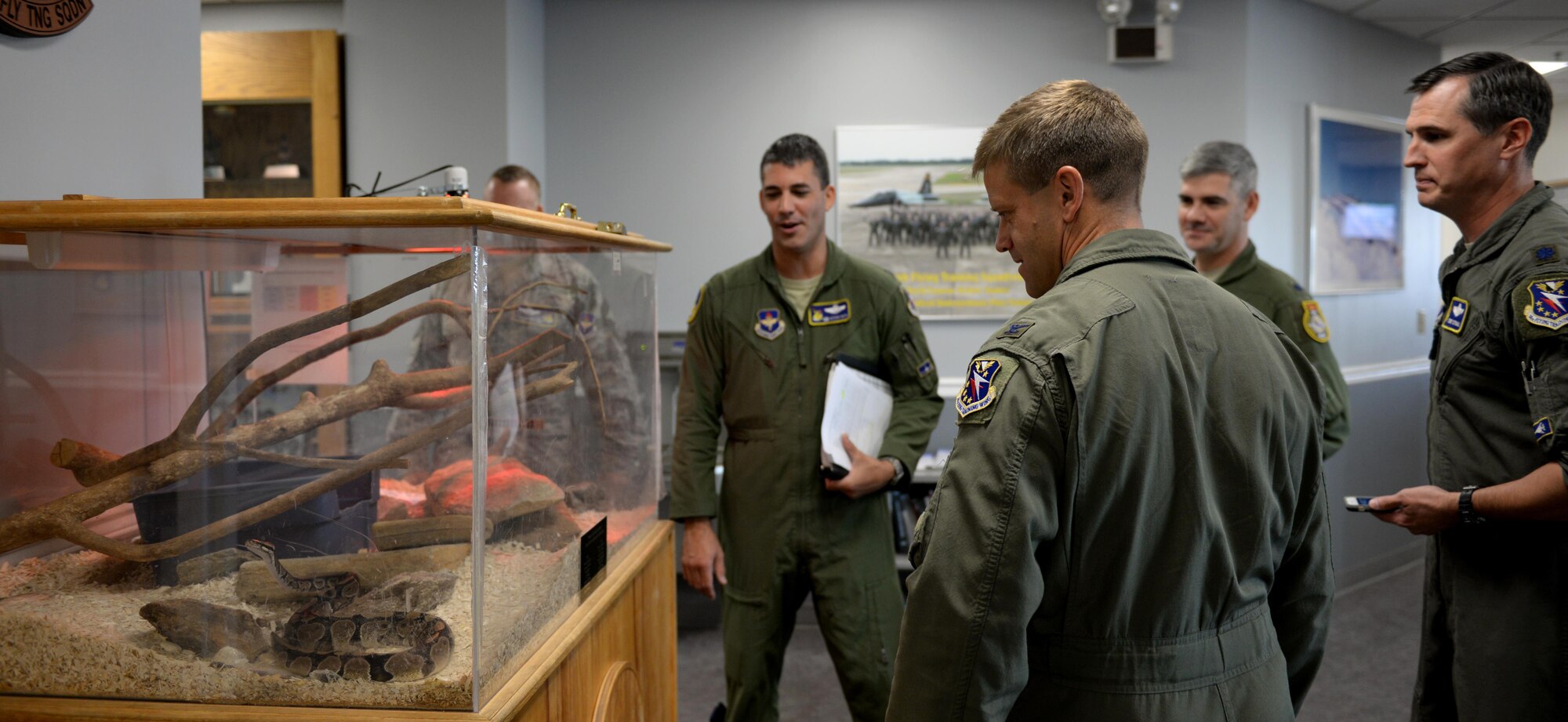 Col. William Denham, 14th Flying Training Wing Vice Commander is shown the 50th Flying Training Squadrons’ pet snake. The 50th FTS is responsible for giving student pilots advanced aircraft handling skills, tactical navigation abilities and more.