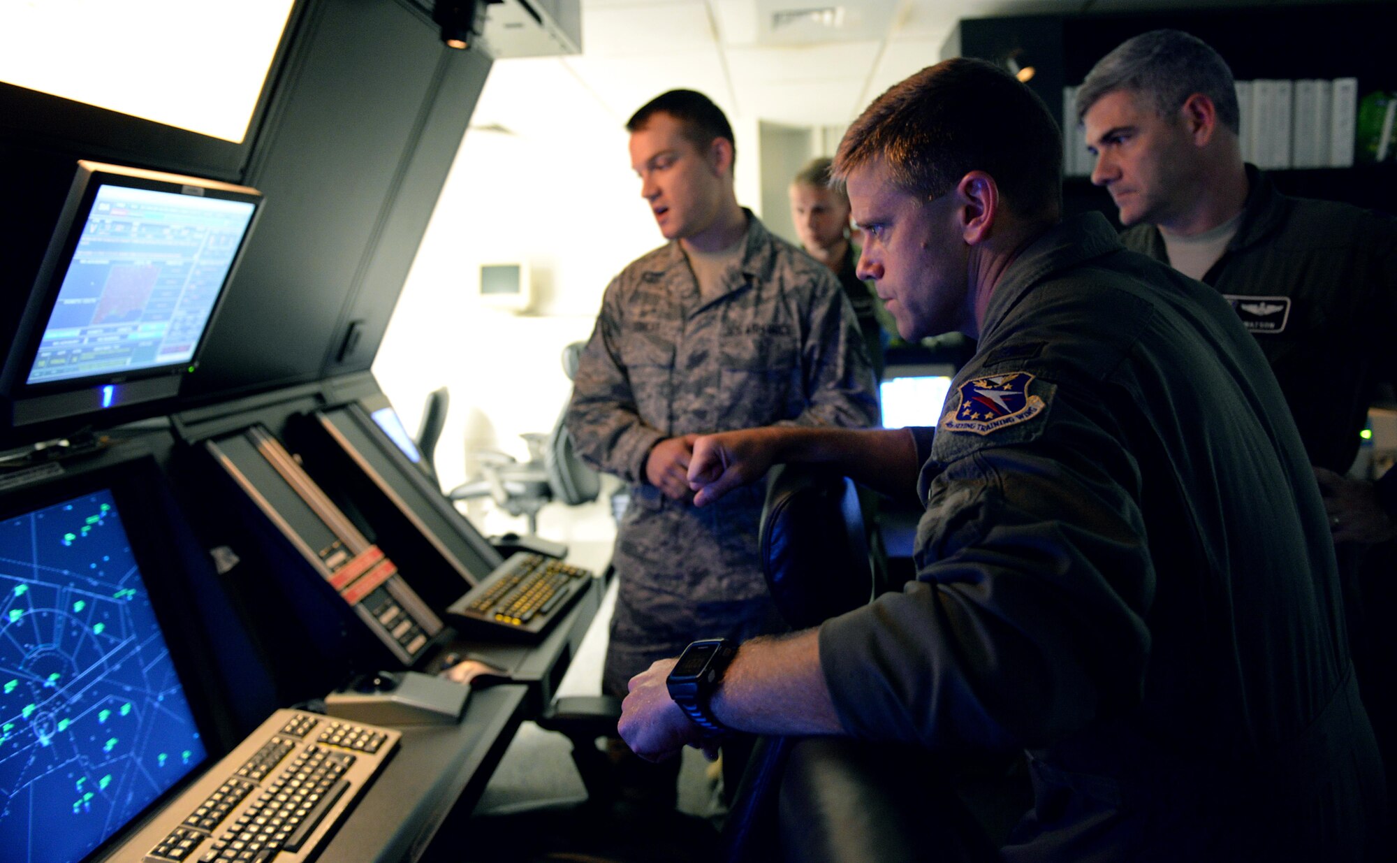 Col. William Denham, 14th Flying Training Wing Vice Commander, is shown the airfield from the perspective of the radar control room July 11, 2017, on Columbus Air Force Base, Mississippi. The Radar Approach Control room is where Air Traffic Controllers direct and coordinate flight paths for aircraft in flight.