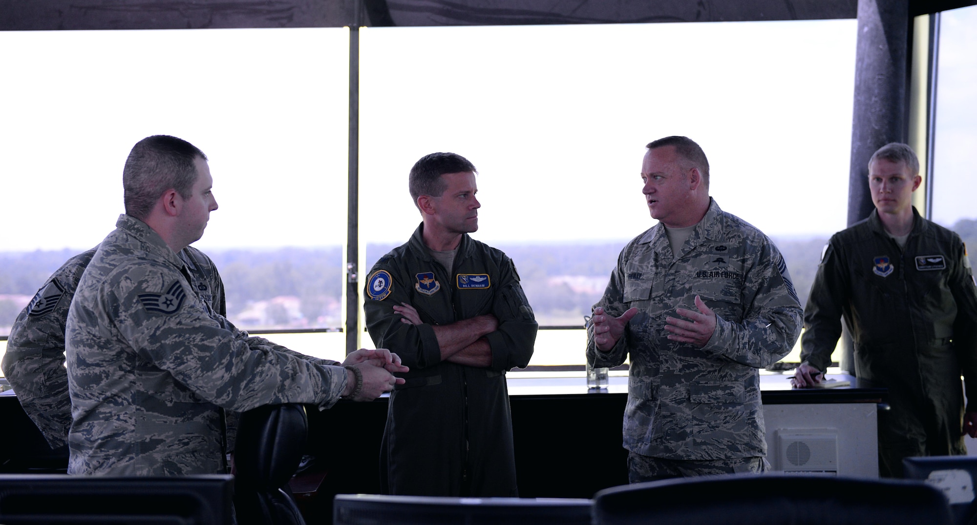 Chief Master Sgt. Bradley Reilly, 14th Operations Group Superintendent and Col. William Denham, 14th Flying Training Wing Vice Commander discuss air traffic control in the control tower on Columbus Air Force Base, Mississippi, July 11, 2017. Columbus Air Traffic Controllers aid in the production of about 475 pilots annually and directly impact the Columbus AFB mission every day.